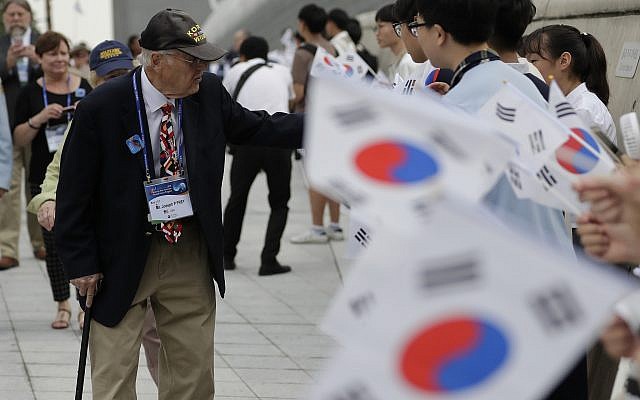 U.S. veteran of the Korean War Joseph P. Frey, left, is welcomed by South Korean students waving South Korean national flags upon veterans arrival to attend the commemorating ceremony for the U.N. Force Participating Day in the Korean War in Seoul, South Korea, Friday, July 27, 2018. (AP/Lee Jin-man) U.S. veteran of the Korean War Joseph P. Frey, left, is welcomed by South Korean students waving South Korean national flags upon veterans arrival to attend the commemorating ceremony for the U.N. Force Participating Day in the Korean War in Seoul, South Korea, Friday, July 27, 2018. (AP/Lee Jin-man)