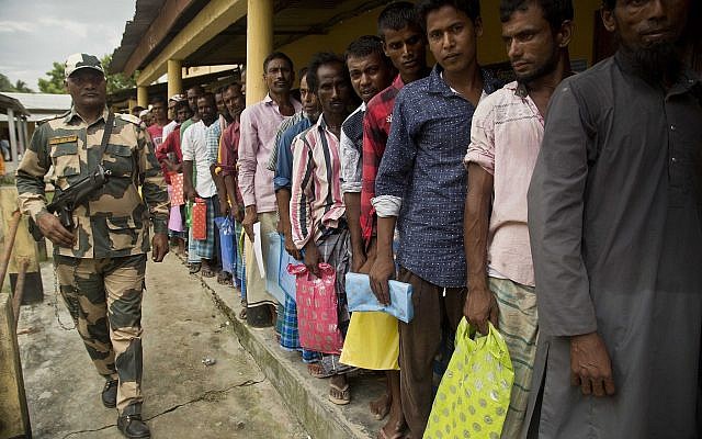 Muslims stand in a queue to check if their names are included in the National Register of Citizens at a draft center in Bur Gaon village, 70 kilometers (44 miles) east of Gauhati, India, July 30, 2018. (AP Photo/Anupam Nath) Muslims stand in a queue to check if their names are included in the National Register of Citizens at a draft center in Bur Gaon village, 70 kilometers (44 miles) east of Gauhati, India, July 30, 2018. (AP Photo/Anupam Nath)