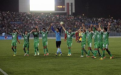 Iraq's national football team celebrates after an international friendly soccer match between Iraq and Syria in Baghdad,, March 26, 2013.  (AP Photo/ Khalid Mohammed/File)
