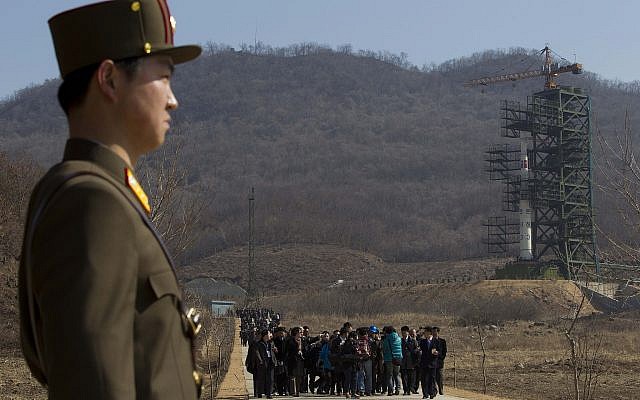 File: In this Sunday, April 8, 2012 file photo, a crowd of media gather around a North Korean official on a road in front of North Korea's Unha-3 rocket, slated for liftoff between April 12-16, stands at Sohae Satellite Station in Tongchang-ri, North Korea (AP Photo/David Guttenfelder, File) File: In this Sunday, April 8, 2012 file photo, a crowd of media gather around a North Korean official on a road in front of North Korea's Unha-3 rocket, slated for liftoff between April 12-16, stands at Sohae Satellite Station in Tongchang-ri, North Korea (AP Photo/David Guttenfelder, File)