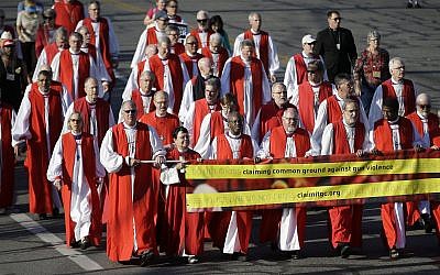 Illustrative: Episcopal Bishops lead a march to urge people of faith to seek common ground to curtail gun violence, during the Episcopal General Convention Sunday, June 28, 2015, in Salt Lake City. (AP Photo/Rick Bowmer) Illustrative: Episcopal Bishops lead a march to urge people of faith to seek common ground to curtail gun violence, during the Episcopal General Convention Sunday, June 28, 2015, in Salt Lake City. (AP Photo/Rick Bowmer)