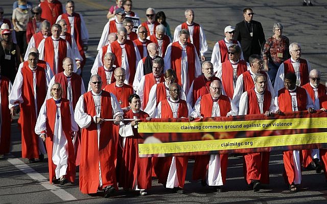 Illustrative: Episcopal Bishops lead a march to urge people of faith to seek common ground to curtail gun violence, during the Episcopal General Convention Sunday, June 28, 2015, in Salt Lake City. (AP Photo/Rick Bowmer) Illustrative: Episcopal Bishops lead a march to urge people of faith to seek common ground to curtail gun violence, during the Episcopal General Convention Sunday, June 28, 2015, in Salt Lake City. (AP Photo/Rick Bowmer)