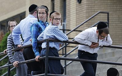 Illustrative: Boys stand outside a school on Tuesday, July 1, 2014, in Kiryas Joel, N.Y. (AP Photo/Mike Groll)
