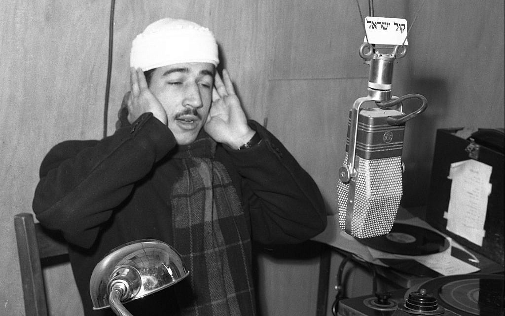 On Israel Radio, a Muslim muezzin calling to prayer, early 1950s. (Efraim Ilani)