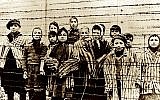 A group of children wearing concentration camp uniforms behind barbed wire fencing in the Oswiecim (Auschwitz) Nazi concentration camp, photographed just after the liberation by the Soviet army, in January 1945. (AP Photo/ File)