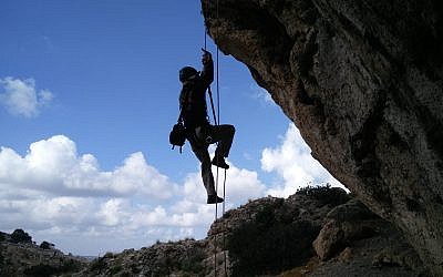 Climbing to a cliff cave on the Lebanon border on June 29, 2018. (Yoav Negev)