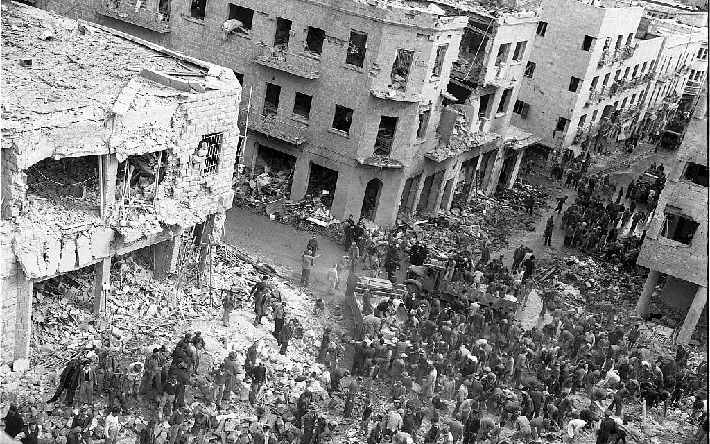 The scene of a car bombing on Jerusalem's Ben Yehuda street, February 22, 1948. Arab terrorists driving British army vehicles blew up, killing between 49 and 58 civilians, and injuring between 140 to 200. (Efraim Ilani)