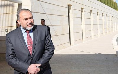 In this file photo, then-foreign minister Avigdor Liberman waits outside the Ministry of Foreign Affairs in Jerusalem for a meeting with his Irish counterpart, Eamon Gilmore, Jan 29, 2012 (Kobi Gideon/Flash90)