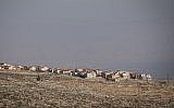 View of the  settlement of Adam (Geva Binyamin), in the West Bank, as seen from the Jewish neighborhood of Neve Yaakov in Jerusalem, January 1, 2017 (Yonatan Sindel/Flash90)