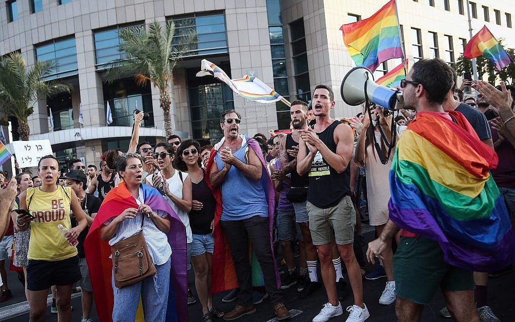 Members of the LGBT community demonstrate   in Tel Aviv against a Knesset legislation that denies surrogacy rights for same-sex couples on July 18, 2018. (Miriam Alster/Flash90)