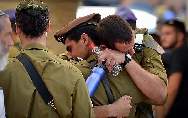 Friends and family attend the funeral of IDF Sgt Aviv Levi of the Givati Brigade in Petach Tikva on July 22, 2018. (Avi Dishi/FLASH90) Friends and family attend the funeral of IDF Sgt Aviv Levi of the Givati Brigade in Petach Tikva on July 22, 2018. (Avi Dishi/FLASH90)