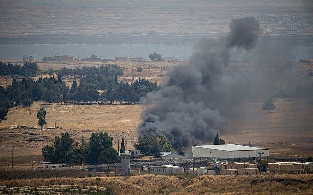 Smoke rises from Quneitra, at the Syrian side of the Israeli-Syrian border in the Golan Heights, on July 22, 2018. (Basel Awidat/Flash90) Smoke rises from Quneitra, at the Syrian side of the Israeli-Syrian border in the Golan Heights, on July 22, 2018. (Basel Awidat/Flash90)