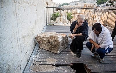 Daniella Goldberg (left), with Culture Minister Miri Regev, inspects the damage caused by a large stone that dislodged from the Western Wall in Jerusalem Old City on July 23, 2013, at the mixed-gender prayer section. The boulder fell close to where Goldberg was praying. (Yonatan Sindel/Flash90) Daniella Goldberg (left), with Culture Minister Miri Regev, inspects the damage caused by a large stone that dislodged from the Western Wall in Jerusalem Old City on July 23, 2013, at the mixed-gender prayer section. The boulder fell close to where Goldberg was praying. (Yonatan Sindel/Flash90)