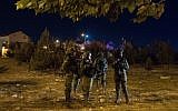 Israeli security forces are seen at the scene of a stabbing attack in the West Bank settlement of Adam on July 26, 2018. (Hadas Parush/Flash90)