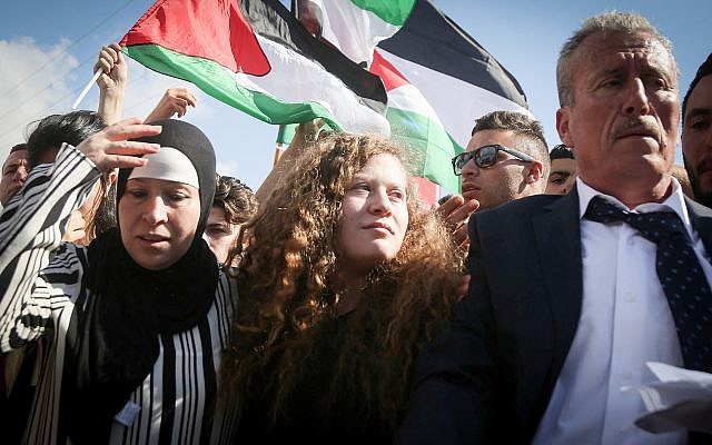 Palestinian teenager Ahed Tamimi (c) is welcomed by relatives and supporters after she was released from Israeli military prison on July 29, 2018. (FLASH90)