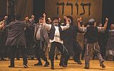 Steven Skybell, center, as Tevye and ensemble in the National Yiddish Theatre Folksbiene’s production of “Fiddler on the Roof.” (Victor Nechay/ProperPix via JTA)