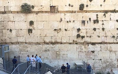 Israel Antiquities Authority professionals assess damage at the Robinson's Arch section of the Western Wall after a stone fell on July 23, 2018. (Hannah Estrin)