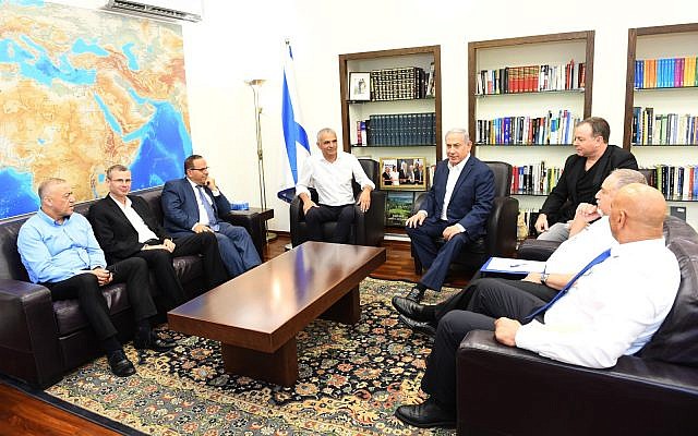 Prime Minister Benjamin Netanyahu (center-right) meets with Finance Minister Moshe Kahlon (center-left), Communications Minister Ayoub Kara (3rd-left), Tourism Minister Yariv Levin (2nd-left), Kulanu MK Akram Hasson (left), Yisrael Beytenu MK Hamad Amar (right), Defense Minister Avigdor Liberman (2nd-right) and his chief of staff Yoav Horowitz (3rd-right) on July 26, 2018. (Haim Tzach/GPO) Prime Minister Benjamin Netanyahu (center-right) meets with Finance Minister Moshe Kahlon (center-left), Communications Minister Ayoub Kara (3rd-left), Tourism Minister Yariv Levin (2nd-left), Kulanu MK Akram Hasson (left), Yisrael Beytenu MK Hamad Amar (right), Defense Minister Avigdor Liberman (2nd-right) and his chief of staff Yoav Horowitz (3rd-right) on July 26, 2018. (Haim Tzach/GPO)