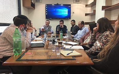 Mendy Klein provides strategic direction and motivation during an Amudim meeting. (Courtesy, Amudim)
