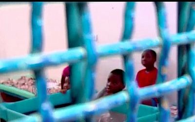 Children of an African migrant from Nigeria who have been jailed with their mother in Ramle's Givon Prison as Israel tries to deport her. (Channel 10 screen capture)