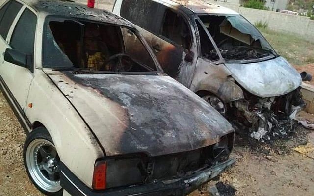 Palestinian cars torched in an apparent hate crime in the northern West Bank town of Urif on July 13, 2018. (Courtesy) Palestinian cars torched in an apparent hate crime in the northern West Bank town of Urif on July 13, 2018. (Courtesy)