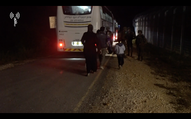 IDF soldiers oversee the transfer of 422 'White Helmet' rescue workers and their families through Israel and into Jordan, as they flee the Assad regime, on July 22, 2018. (Israel Defense Forces) IDF soldiers oversee the transfer of 422 'White Helmet' rescue workers and their families through Israel and into Jordan, as they flee the Assad regime, on July 22, 2018. (Israel Defense Forces)