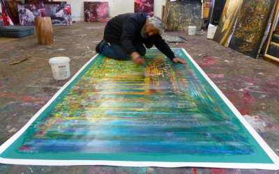 Artist Yoram Raanan putting the final touches on one of his recent artworks (Courtesy Yoram Raanan)