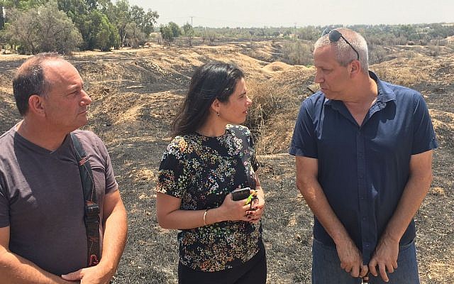 Justice Minister Ayelet Shaked (C) meeting residents of Israeli communities near the Gaza Strip on July 3, 2018, at a field burned by incendiary balloons and kites. (Courtesy) Justice Minister Ayelet Shaked (C) meeting residents of Israeli communities near the Gaza Strip on July 3, 2018, at a field burned by incendiary balloons and kites. (Courtesy)