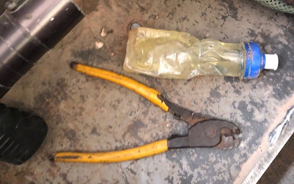 A set of wire-cutters and a bottle of flamable liquid that the military found in the possession of a Palestinian man who tried to cross into Israel from the southern Gaza Strip on July 11, 2018. (Israel Defense Forces)