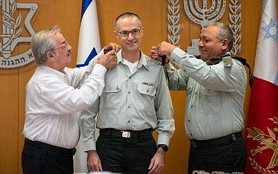 Military Advocate General Sharon Afek receives the rank of major general from IDF Chief of Staff Gadi Eisenkot, right, during a ceremony in the IDF's Tel Aviv headquarters on July 12, 2018. (Israel Defense Forces)