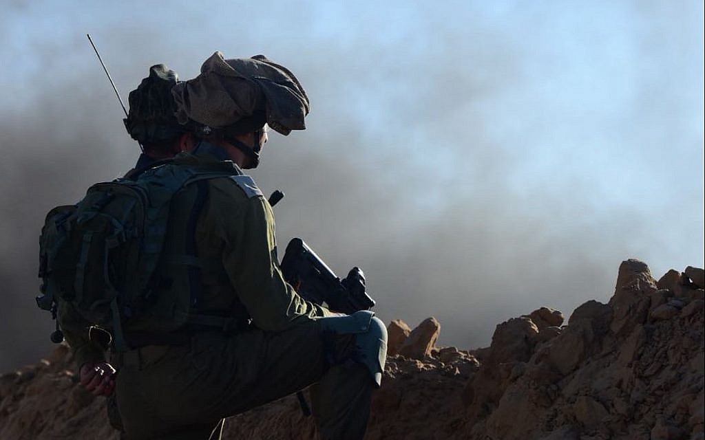 Illustrative: Israeli soldiers in defensive positions on an embankment near the Gaza border during a violent Palestinian protest, July 27, 2018 (Israel Defense Forces) Illustrative: Israeli soldiers in defensive positions on an embankment near the Gaza border during a violent Palestinian protest, July 27, 2018 (Israel Defense Forces)