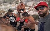 Tunisian men photographed barbecuing in the Jewish cemetery in the coastal city of Sousse, July 2018. (Courtesy)
