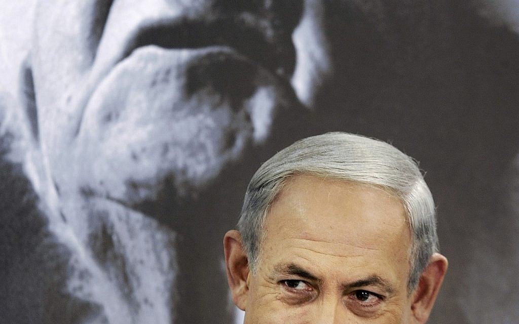 Prime Minister Benjamin Netanyahu chairs a cabinet meeting at Kibbutz Sde Boker, Israel, Sunday, Nov. 10, 2013. A portrait of the first Israeli prime minister David Ben Gurion is seen at background. (AP Photo/David Buimovitch, Pool) Prime Minister Benjamin Netanyahu chairs a cabinet meeting at Kibbutz Sde Boker, Israel, Sunday, Nov. 10, 2013. A portrait of the first Israeli prime minister David Ben Gurion is seen at background. (AP Photo/David Buimovitch, Pool)