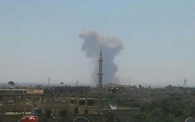 Smoke rises after a reported explosion near the town of Mhajja in southern Syria (Facebook photo) Smoke rises after a reported explosion near the town of Mhajja in southern Syria (Facebook photo)
