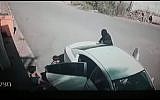 This screen capture shows a masked man kidnapping 7-year-old Karim Jumhour from outside his home in the Arab city of Qalansawe in July 2018. (Screen capture: Facebook)