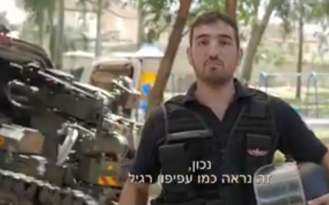 A police sapper in an informational video by the Israel Police urging kids to steer clear of potentially dangerous kites and balloons over the summer that may have been sent over the border from Gaza, in a screen shot taken on July 6, 2018. (Israel Police/Twitter screenshot) A police sapper in an informational video by the Israel Police urging kids to steer clear of potentially dangerous kites and balloons over the summer that may have been sent over the border from Gaza, in a screen shot taken on July 6, 2018. (Israel Police/Twitter screenshot)