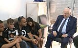 President Reuven Rivlin, right, visits the family of Staff Sgt. Aviv Levi, killed Friday by a sniper on the Gaza border, on July 23 , 2018. (Avi Kanner/GPO)