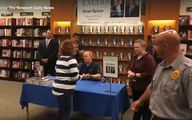 Former White House press secretary Sean Spicer (seated) at a book signing event in Newport News on July 27, 2018. (Screen capture: Facebook) Former White House press secretary Sean Spicer (seated) at a book signing event in Newport News on July 27, 2018. (Screen capture: Facebook)