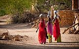 Illustrative image of women carrying water in a village in India (FrankCornfield; iStock by Getty Images)