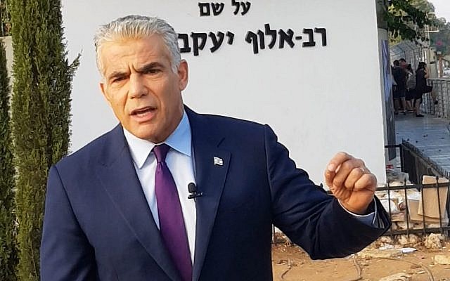 Yesh Atid leader MK Yair Lapid speaks to reporters outside the IDF's main recruitment base, the Bakum, in Tel Hashomer on August 13, 2018. (Courtesy) Yesh Atid leader MK Yair Lapid speaks to reporters outside the IDF's main recruitment base, the Bakum, in Tel Hashomer on August 13, 2018. (Courtesy)