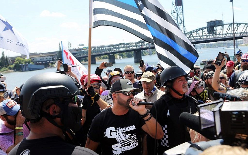 Joey Gibson, rally organizer, Patriot Prayer founder and Republican Senate candidate, addresses alt-right activists in Portland, Oregon, August 4, 2018. (AFP/ Thomas Patterson)