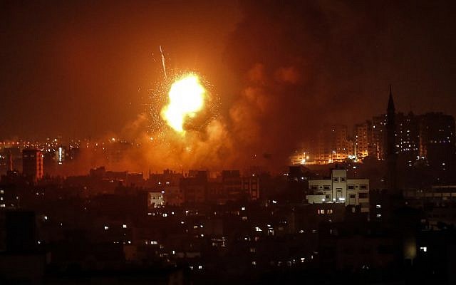 A picture taken on August 8, 2018 in Gaza City shows smoke plumes rising following an Israeli air strike. (AFP/MAHMUD HAMS)