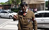 Indian film actor-turned-politician Naramalli Sivaprasad arrives at parliament dressed as Adolf Hitler to press for government funding for his home state of Andhra Pradesh, in New Delhi on August 9, 2018. (AFP)