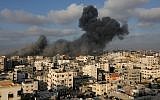 A plume of smoke rises from the remains of a building west of Gaza City that was targeted by the Israeli Air Force in response to a rocket attack that hit southern Israel earlier in the day on August 9, 2018. (AFP Photo/Mahmud Hams)