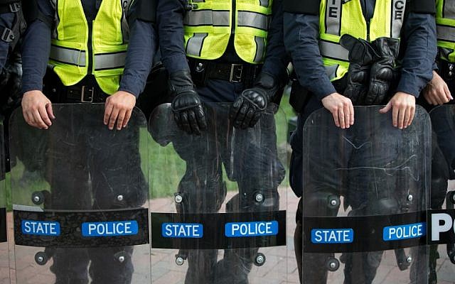 Virginia State Troopers stand down during a rally on the campus of The University of Virginia one-year after the violent white nationalist rally that left one person dead and dozens injured, in Charlottesville, Virginia on August 11, 2018.  (AFP PHOTO / Logan Cyrus)