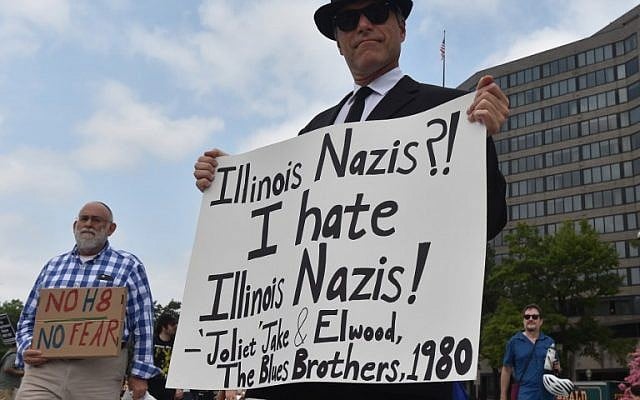 Demonstrators opposed to a far-right rally being held near the White House gather August 12, 2018 in Washington, DC, one year after deadly violence at a similar protest in Charlottesville, Virginia. (AFP PHOTO / Nicholas Kamm) Demonstrators opposed to a far-right rally being held near the White House gather August 12, 2018 in Washington, DC, one year after deadly violence at a similar protest in Charlottesville, Virginia. (AFP PHOTO / Nicholas Kamm)