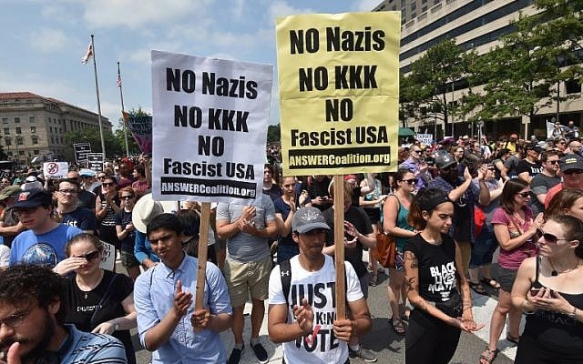Demonstrators opposed to a far-right rally being held near the White House gather August 12, 2018 in Washington, DC, one year after deadly violence at a similar protest in Charlottesville, Virginia. (AFP PHOTO / Nicholas Kamm) Demonstrators opposed to a far-right rally being held near the White House gather August 12, 2018 in Washington, DC, one year after deadly violence at a similar protest in Charlottesville, Virginia. (AFP PHOTO / Nicholas Kamm)