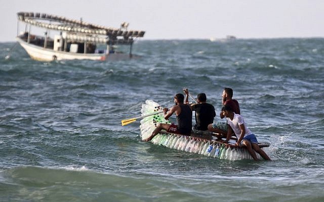 Palestinian fisherman Mouad Abu Zeid and his friends ride on his boat that he made of 700 Plastic empty bottles in the sea in Rafah in the southern Gaza Strip on August 14, 2018. (AFP PHOTO / SAID KHATIB) Palestinian fisherman Mouad Abu Zeid and his friends ride on his boat that he made of 700 Plastic empty bottles in the sea in Rafah in the southern Gaza Strip on August 14, 2018. (AFP PHOTO / SAID KHATIB)