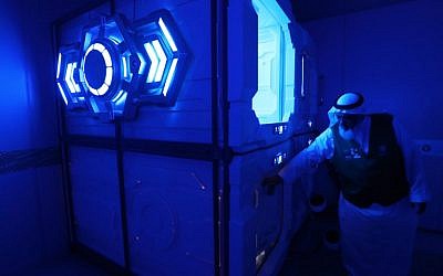 Mansour al-Amer, head of Saudi charity the Haji and Mutamer Gift Charitable Association, stands next to sleep pods in Mecca on August 16, 2018. (AFP Photo/Ahmad Al-Rubaye)