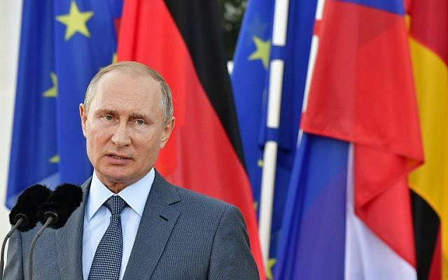 Russian President Vladimir Putin and the German Chancellor give a joint statement on August 18, 2018 at Schloss Meseberg castle in Meseberg, Germany. (AFP Photo/Tobias Schwartz) Russian President Vladimir Putin and the German Chancellor give a joint statement on August 18, 2018 at Schloss Meseberg castle in Meseberg, Germany. (AFP Photo/Tobias Schwartz)